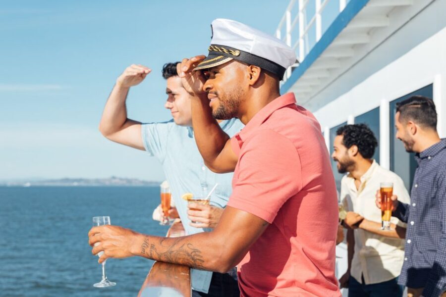 San Diego: Bay Sights and Sips Sunset Cruise - Happy hour entertainment: fun energy, not a guaranteed soundtrack