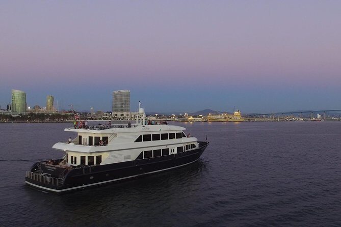 San Diego Harbor Dinner Cruise - Dinner in the enclosed cabin: plated meal + skyline through huge windows